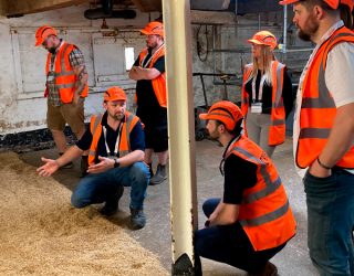Maltings open day; brewers and distillers visiting floor maltings at Great Ryburgh, Norfolk.