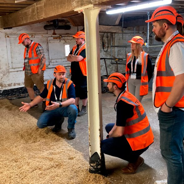 Maltings open day; brewers and distillers visiting floor maltings at Great Ryburgh, Norfolk.